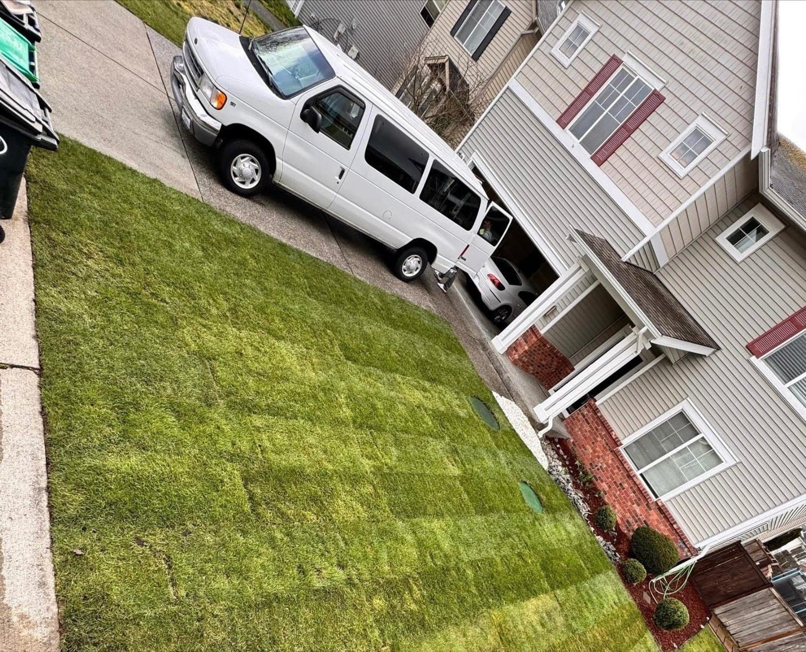 Aerial view of a freshly striped lawn and driveway